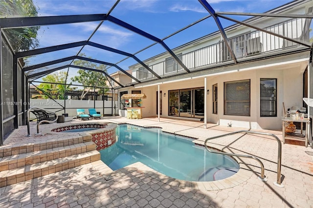 view of swimming pool with an in ground hot tub, a fenced in pool, and a patio