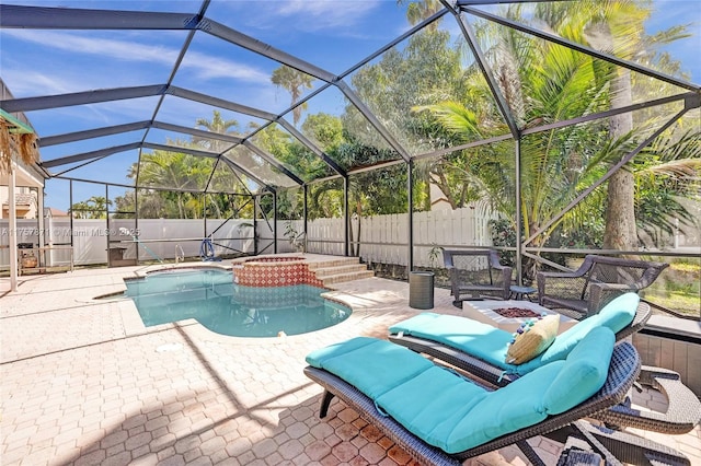 view of pool with a fenced backyard, a lanai, a fire pit, a fenced in pool, and a patio area