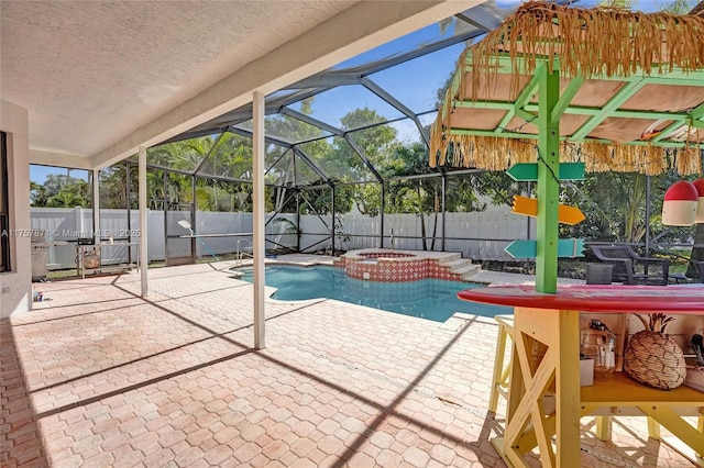 view of swimming pool featuring a fenced in pool, a patio area, a fenced backyard, and an in ground hot tub