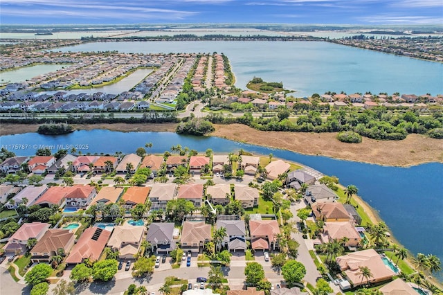 bird's eye view with a water view and a residential view