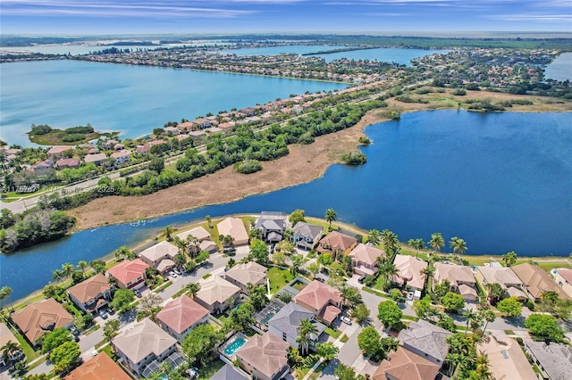 birds eye view of property featuring a residential view and a water view