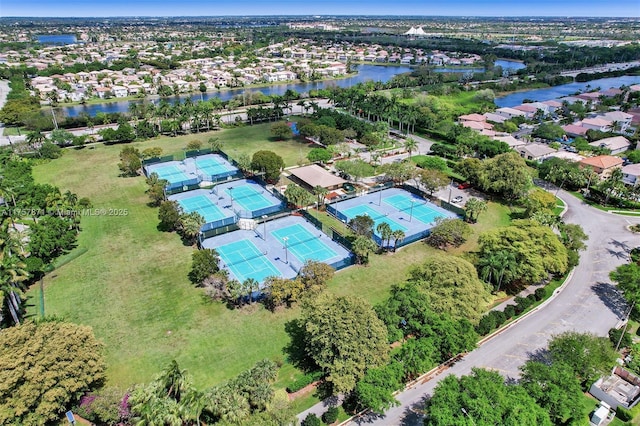 drone / aerial view featuring a water view and a residential view