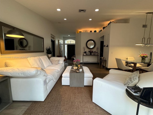 living room featuring recessed lighting and visible vents