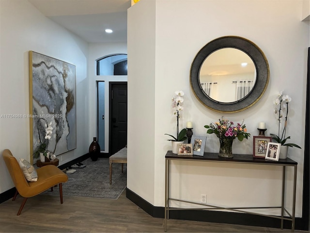 hall with wood finished floors and baseboards