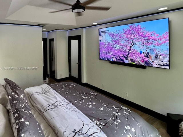 home theater with recessed lighting, wood finished floors, baseboards, and ceiling fan