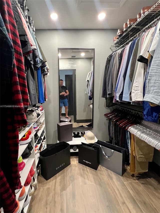 spacious closet featuring wood finished floors