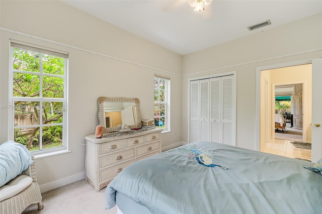 7685 SW 153rd St, Palmetto Bay, FL 33157 - bedroom featuring light colored carpet, a closet, visible vents, and baseboards
