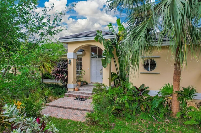 7685 SW 153rd St, Palmetto Bay, FL 33157 - view of exterior entry featuring stucco siding