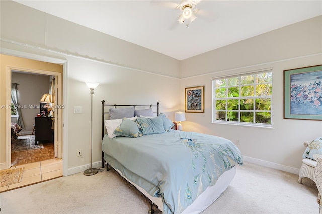 7685 SW 153rd St, Palmetto Bay, FL 33157 - bedroom with a ceiling fan, light colored carpet, baseboards, and light tile patterned floors