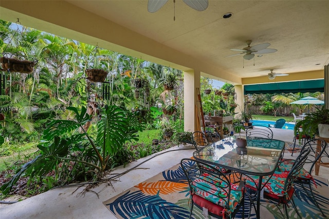7685 SW 153rd St, Palmetto Bay, FL 33157 - view of patio featuring a ceiling fan, outdoor dining area, a fenced backyard, and an outdoor pool