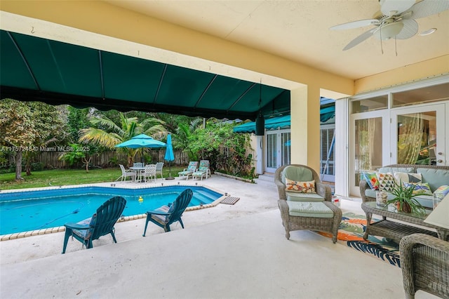 7685 SW 153rd St, Palmetto Bay, FL 33157 - view of swimming pool featuring a fenced in pool, a patio, outdoor lounge area, outdoor dining space, and a fenced backyard