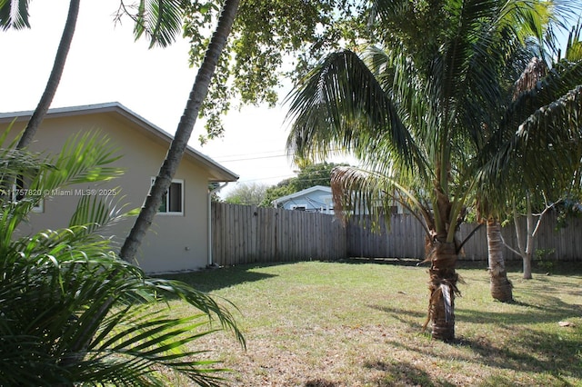 view of yard with a fenced backyard