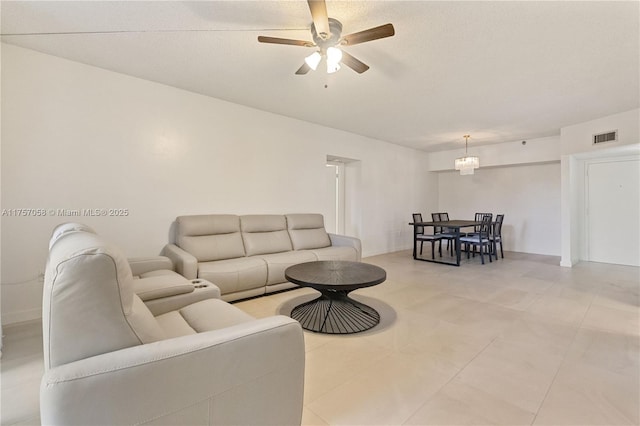 living room featuring visible vents and ceiling fan