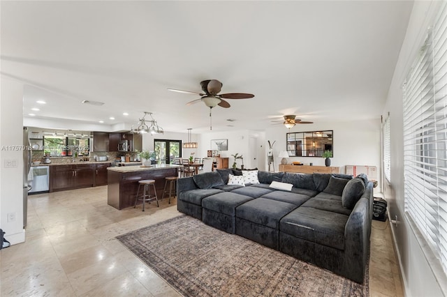 living area with an inviting chandelier and recessed lighting