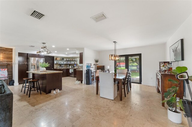 dining space with recessed lighting and visible vents