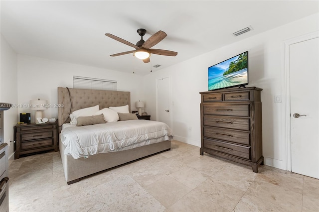 bedroom featuring a ceiling fan, visible vents, and baseboards