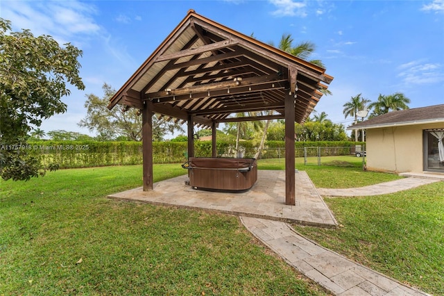 view of yard featuring a gazebo, a patio area, fence, and a hot tub