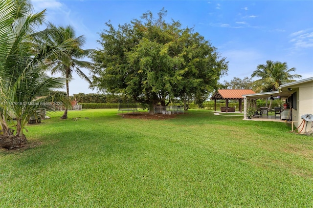 view of yard featuring a patio and a gazebo