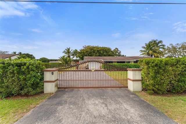 view of gate with fence