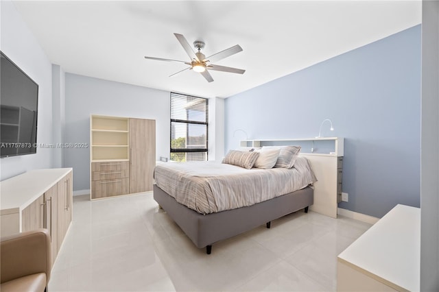 bedroom with baseboards, a ceiling fan, and light tile patterned flooring