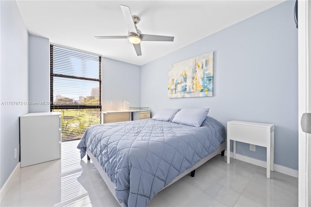 bedroom featuring a ceiling fan and baseboards