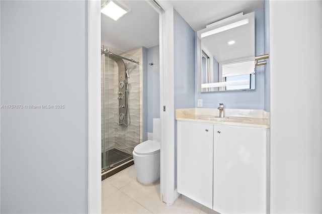 bathroom with toilet, a stall shower, vanity, and tile patterned floors