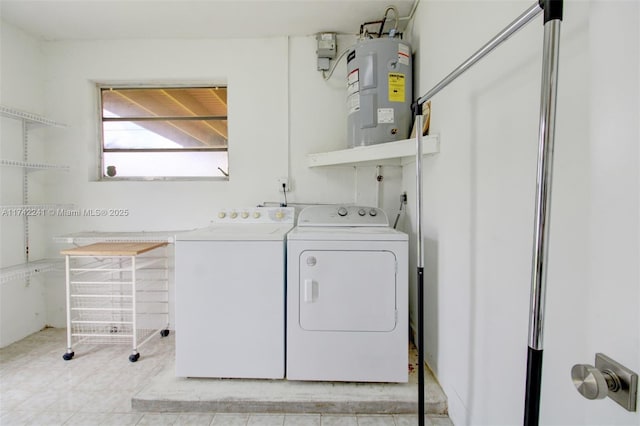 laundry room featuring laundry area, washing machine and clothes dryer, and electric water heater