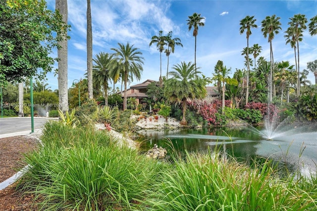 surrounding community featuring a water view