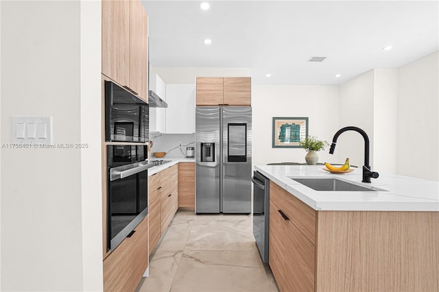 kitchen featuring marble finish floor, stainless steel appliances, visible vents, a sink, and modern cabinets