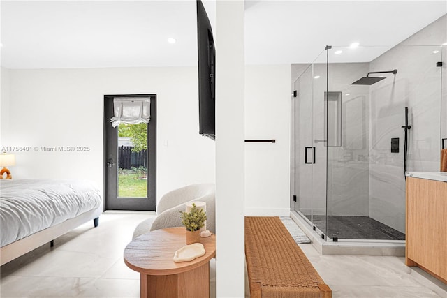 bathroom featuring recessed lighting, marble finish floor, and a shower stall