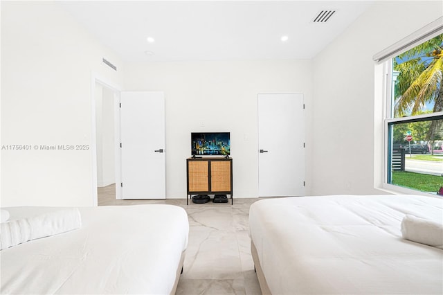 bedroom with marble finish floor, visible vents, and recessed lighting