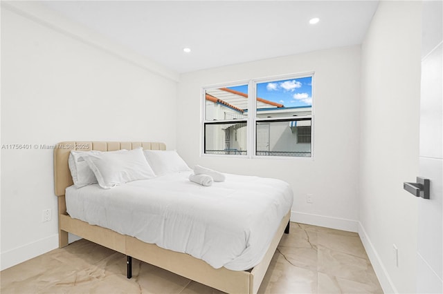 bedroom with recessed lighting and baseboards