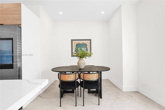 dining area with recessed lighting and baseboards