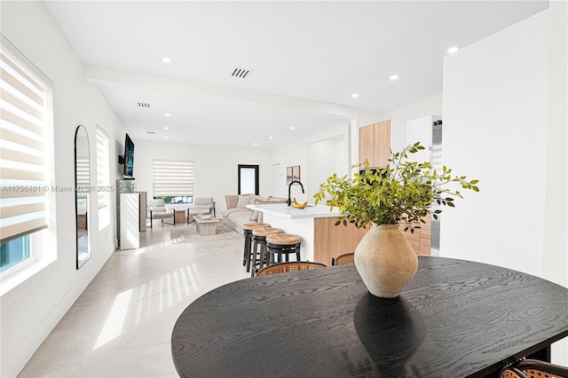 dining area with a wealth of natural light, visible vents, and recessed lighting