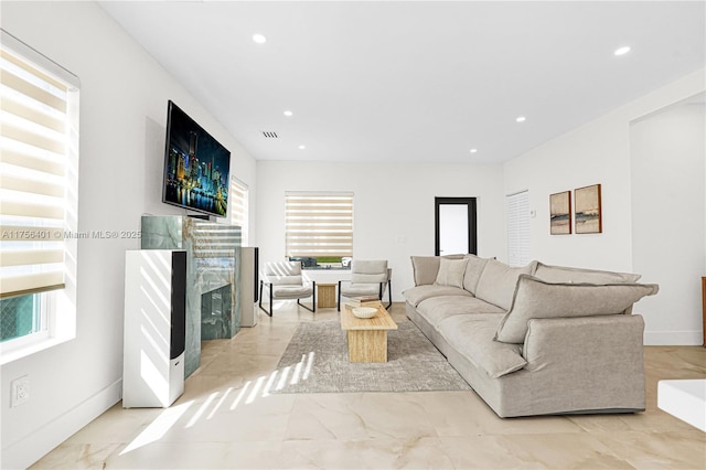 living room featuring marble finish floor, a fireplace, recessed lighting, visible vents, and baseboards