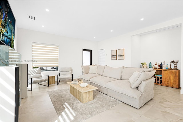 living room with visible vents and recessed lighting