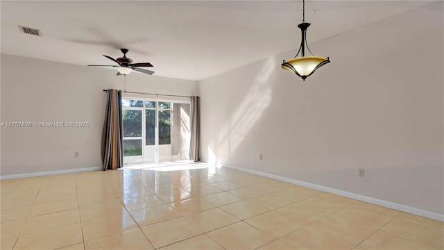 unfurnished room with a ceiling fan, light tile patterned flooring, visible vents, and baseboards