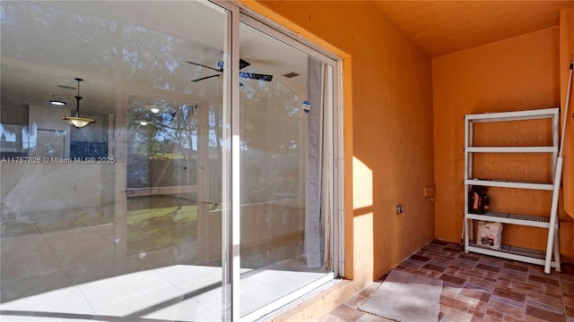 bathroom featuring ceiling fan and walk in shower