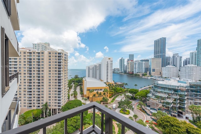 balcony with a water view and a city view