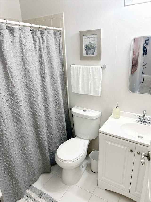 full bathroom featuring vanity, tile patterned flooring, toilet, and a shower with curtain