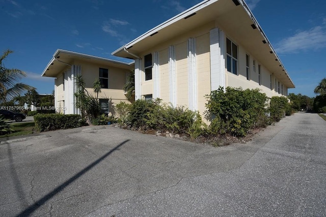 view of side of home featuring concrete block siding