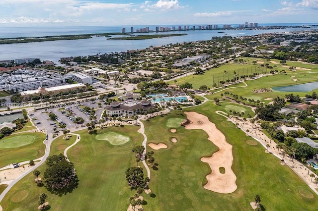 bird's eye view featuring view of golf course and a water view