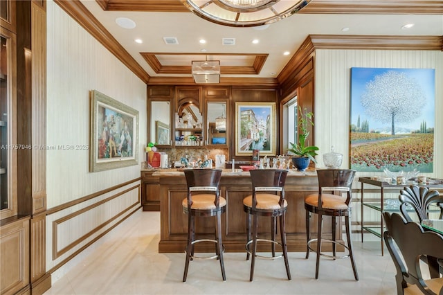 bar with recessed lighting, indoor wet bar, visible vents, and crown molding