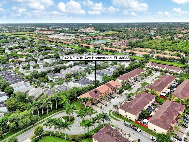 aerial view with a water view and a residential view