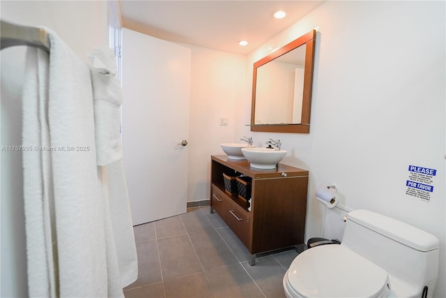 bathroom featuring toilet, recessed lighting, vanity, and tile patterned floors