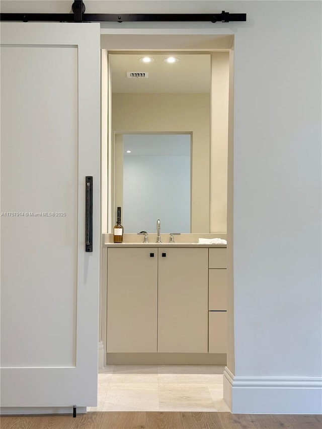 bathroom with recessed lighting, visible vents, and vanity