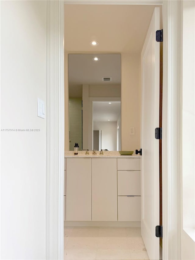 bathroom featuring recessed lighting, visible vents, and vanity