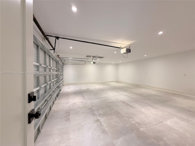 garage featuring baseboards, recessed lighting, and a garage door opener