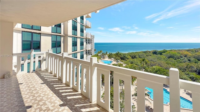 balcony featuring a water view