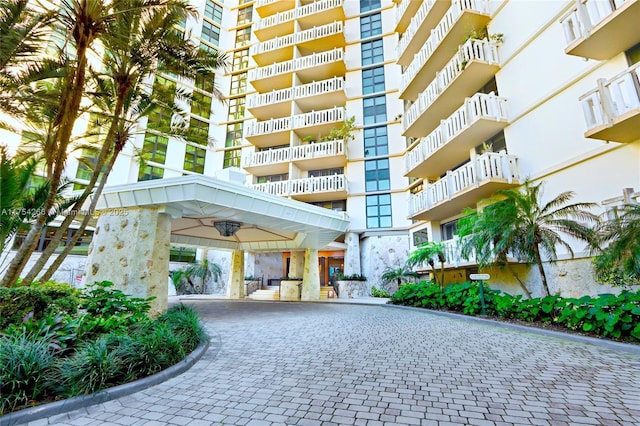 view of property with decorative driveway